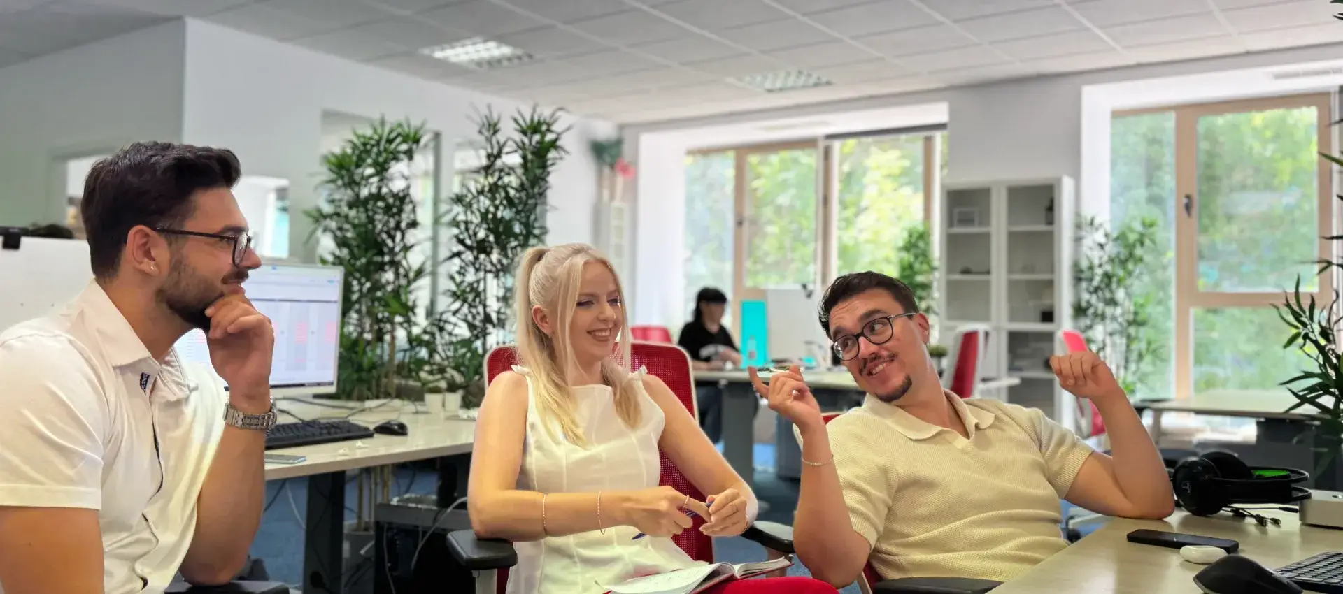 3 OnlyFans Agency account managers sat at a desk
