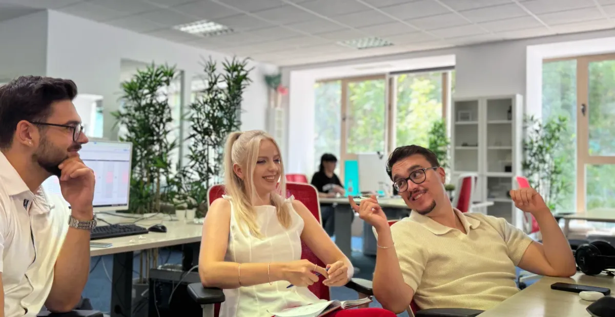 3 OnlyFans Agency account managers sat at a desk